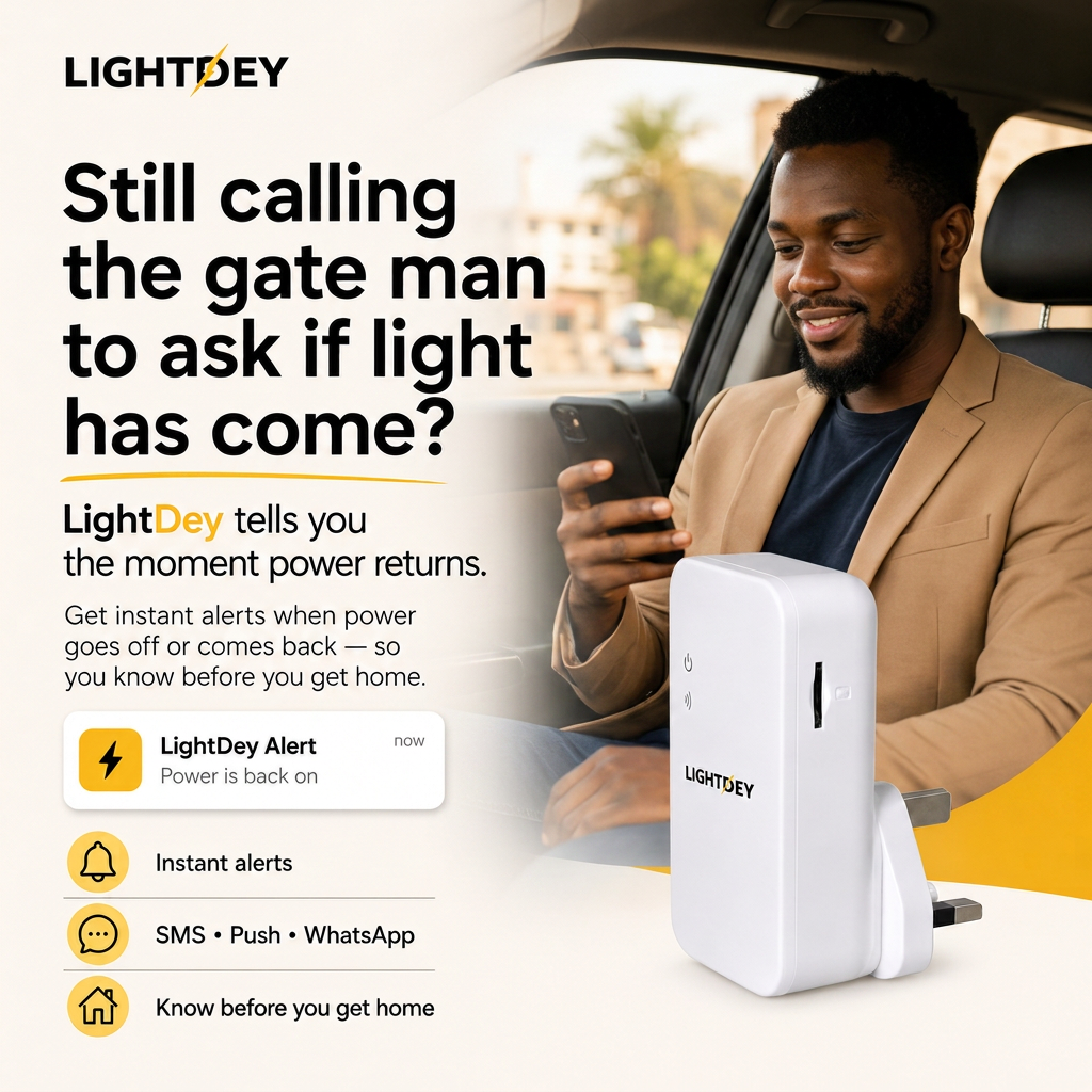 A man in his car on the way home smiling at a LightDey alert saying power is back on